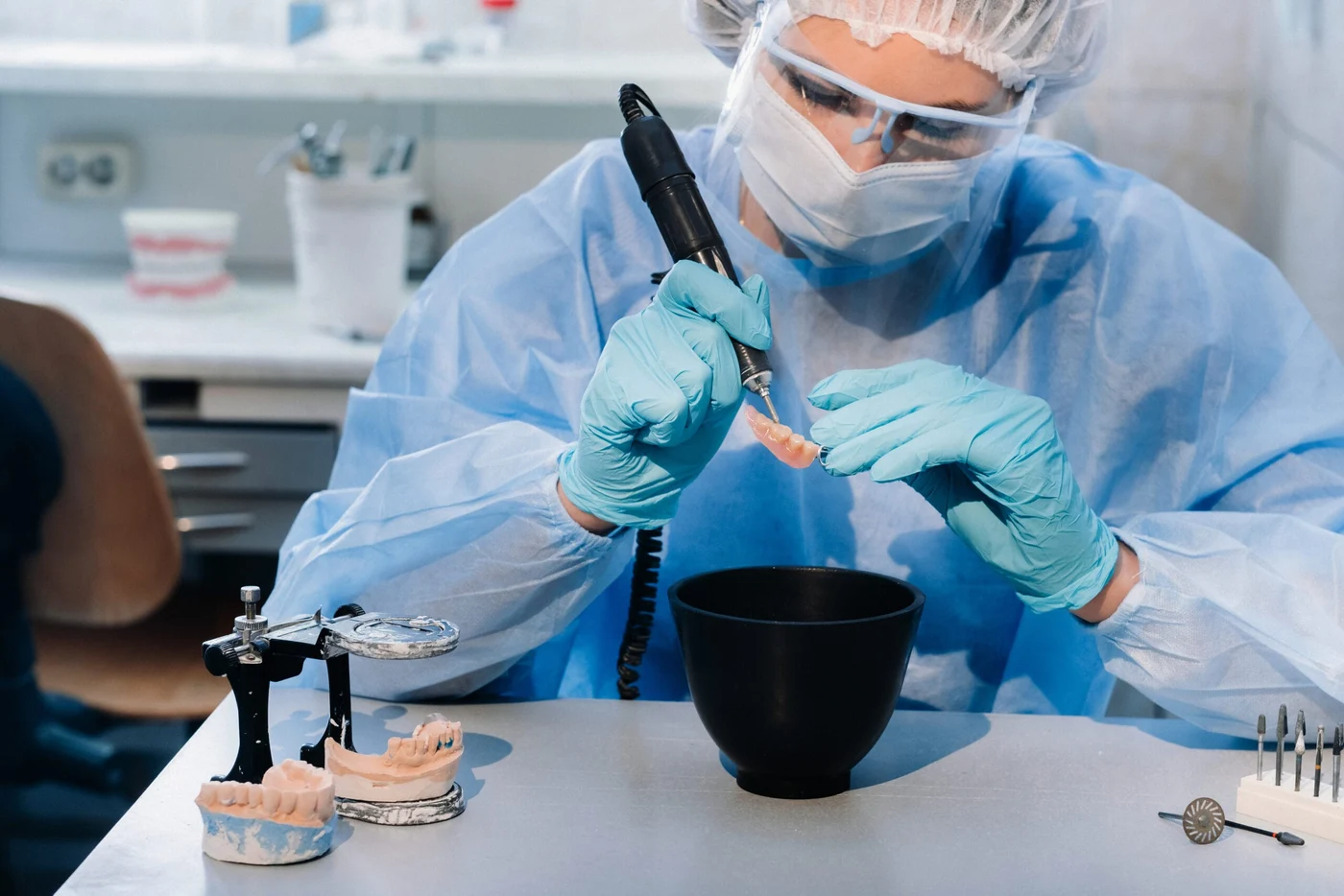 A dental lab technician at work
